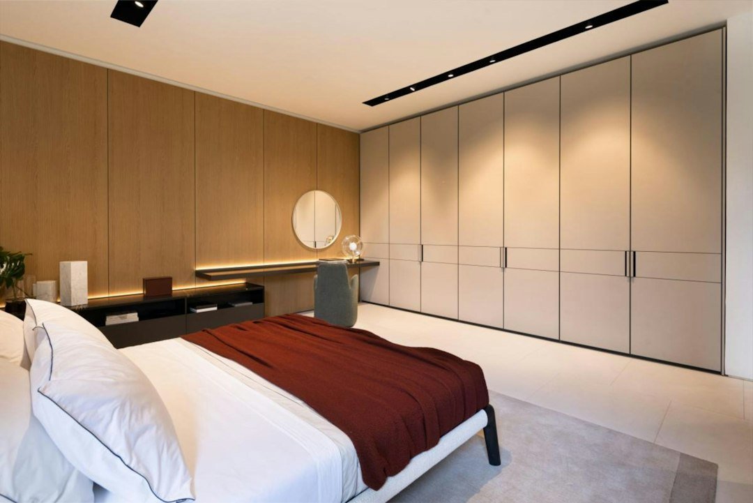 Sunlit bedroom with warm wood and soft textures