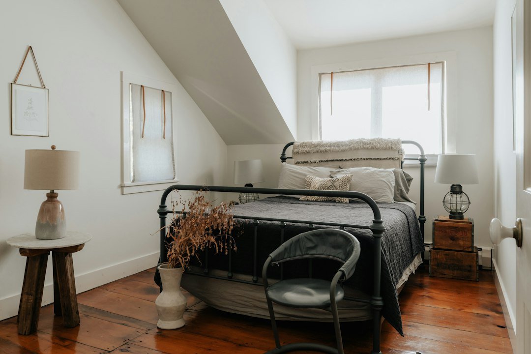 Neutral bedroom with layered sheets and bedding