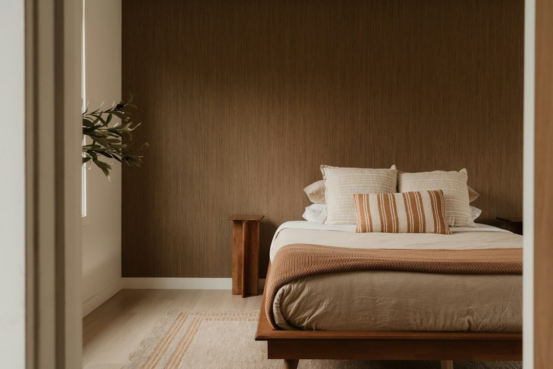 Neutral bedroom with pillows and natural bedding